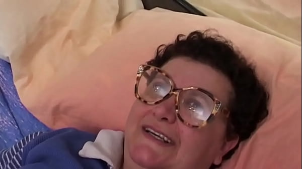 Horny old lady masturbates with a dildo at home